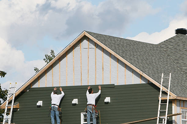 Professional Storm Damage Siding Repair technician working in East Earl, PA